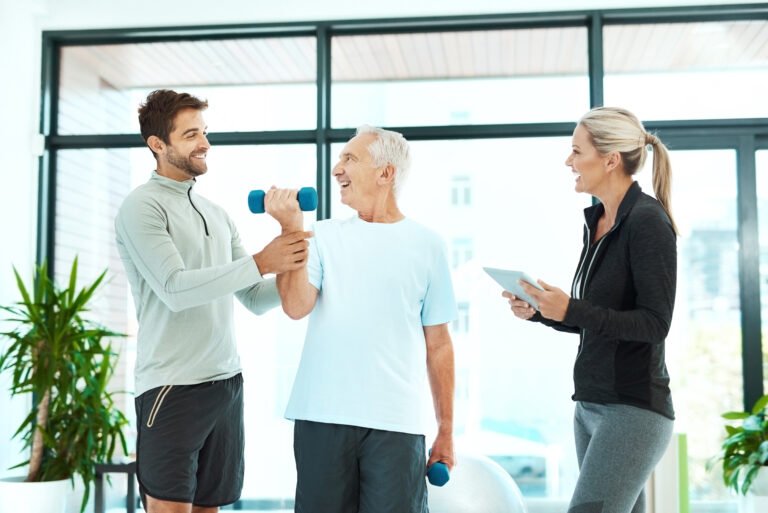 Shot of physiotherapists working with a senior therapist